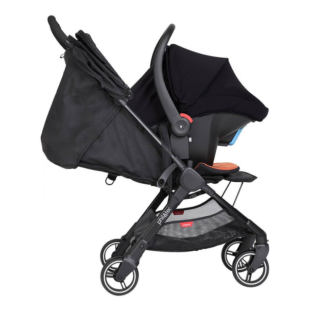 alpha™ infant car seat shown as a travel system using optional travel adaptors on a phil&teds® sport™ buggy